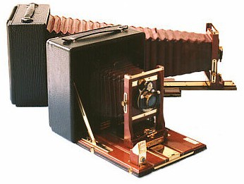 A pair of 5x7 cameras with one fully extended.
